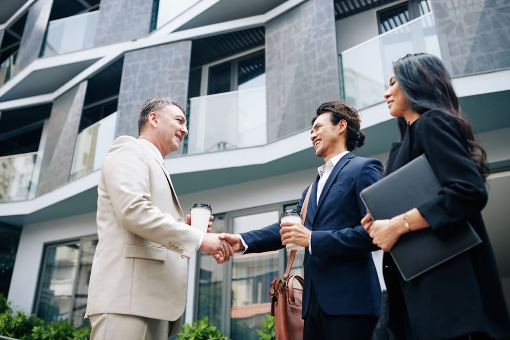 Commercial real estate clients shaking hands