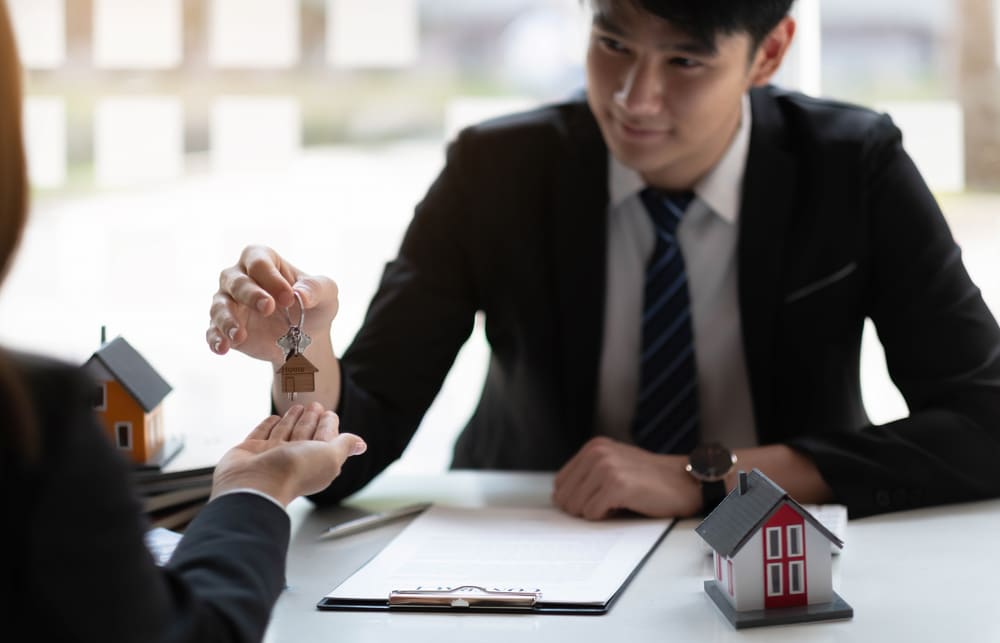 First-time home buyer receiving house keys